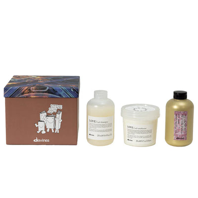 Davines Love Curl More Inside Gift Set featuring shampoo, conditioner, and curl building serum in a decorative box.