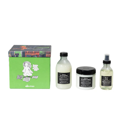 Davines OI Traditional Gift Set with OI Shampoo, Conditioner, and Oil for soft, shiny hair in vibrant packaging.