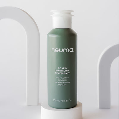 Neuma Re Neu Conditioner bottle with peppermint and vanilla aroma for soft, shiny, and nourished hair.
