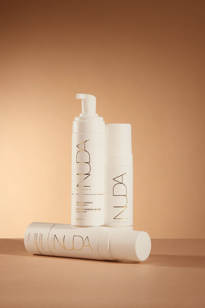 Body Essentials Trio including exfoliant, body wash, and cream for perfect sunless tanning experience.