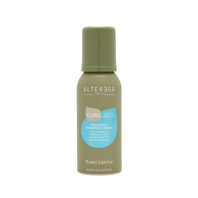 Whipped cream hair product in a green bottle, perfect for improving hydration and shine for all hair types.