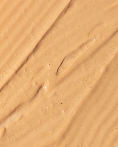 Creamy texture of Vivier Ultra Purifying Clay Mask, featuring red and white Kaolin clay for skincare benefits.