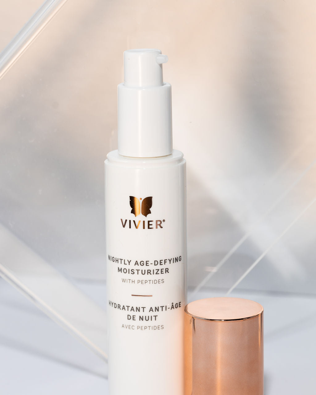 Vivier Nightly Age-Defying Moisturizer with peptides in a sleek pump bottle for hydration and anti-aging benefits.