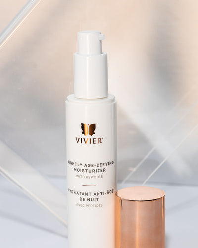 Vivier Nightly Age-Defying Moisturizer with peptides in a sleek pump bottle for hydration and anti-aging benefits.