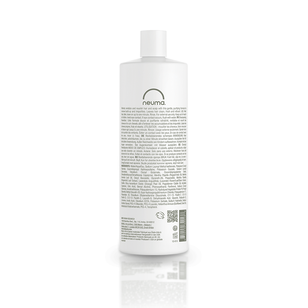 Back view of Neuma Re Neu Clarifying Shampoo bottle showcasing product information and ingredients.