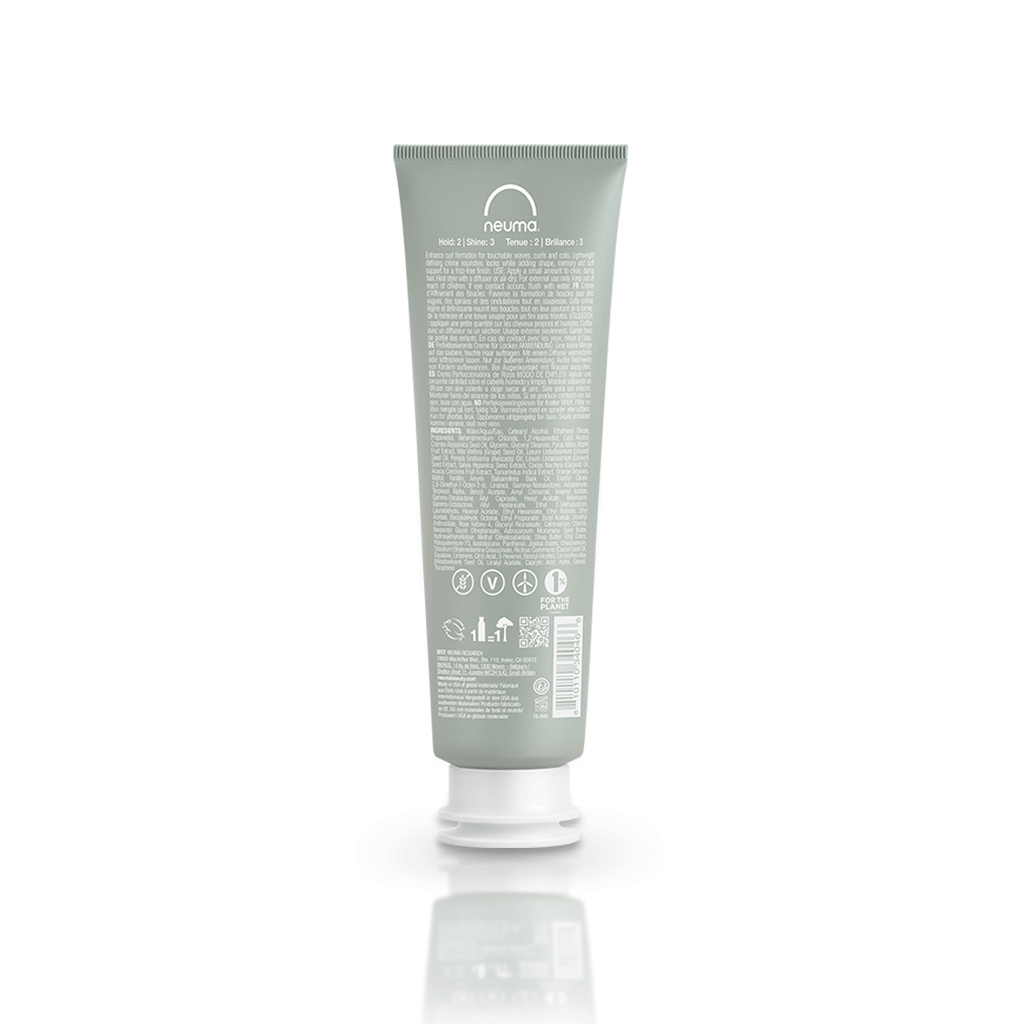 Neu Curl Perfecting Crème tube showcasing lightweight formula for defined curls and frizz-free finish, coconut hibiscus scent.