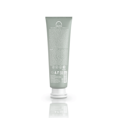 Neu Curl Perfecting Crème tube showcasing lightweight formula for defined curls and frizz-free finish, coconut hibiscus scent.