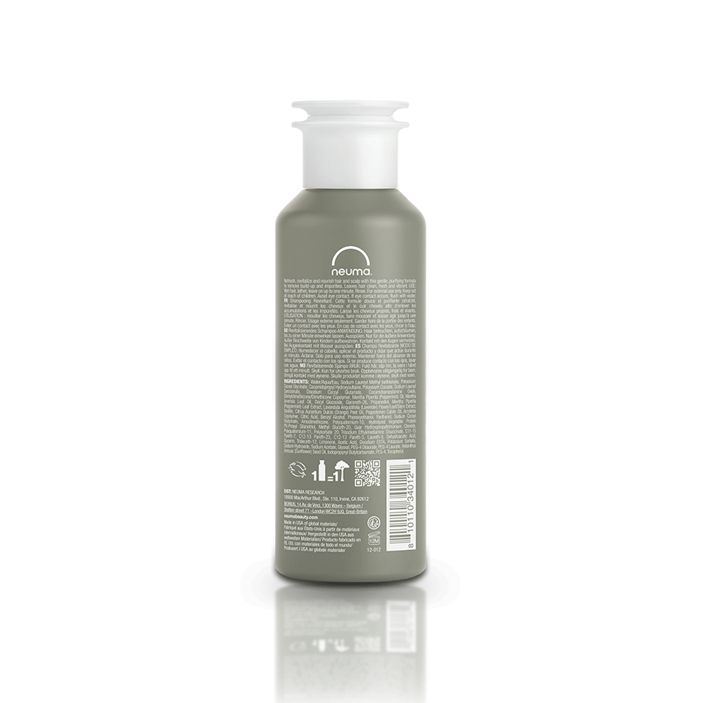 Re Neu Clarifying Shampoo bottle back view, showcasing nourishing ingredients and coconut-derived surfactant.