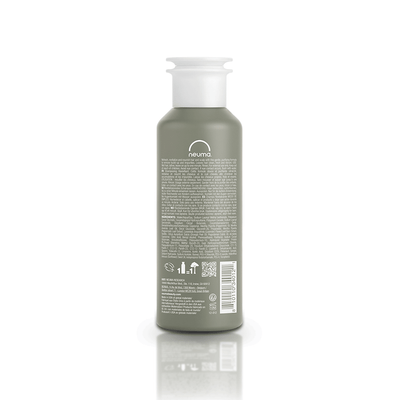 Re Neu Clarifying Shampoo bottle back view, showcasing nourishing ingredients and coconut-derived surfactant.