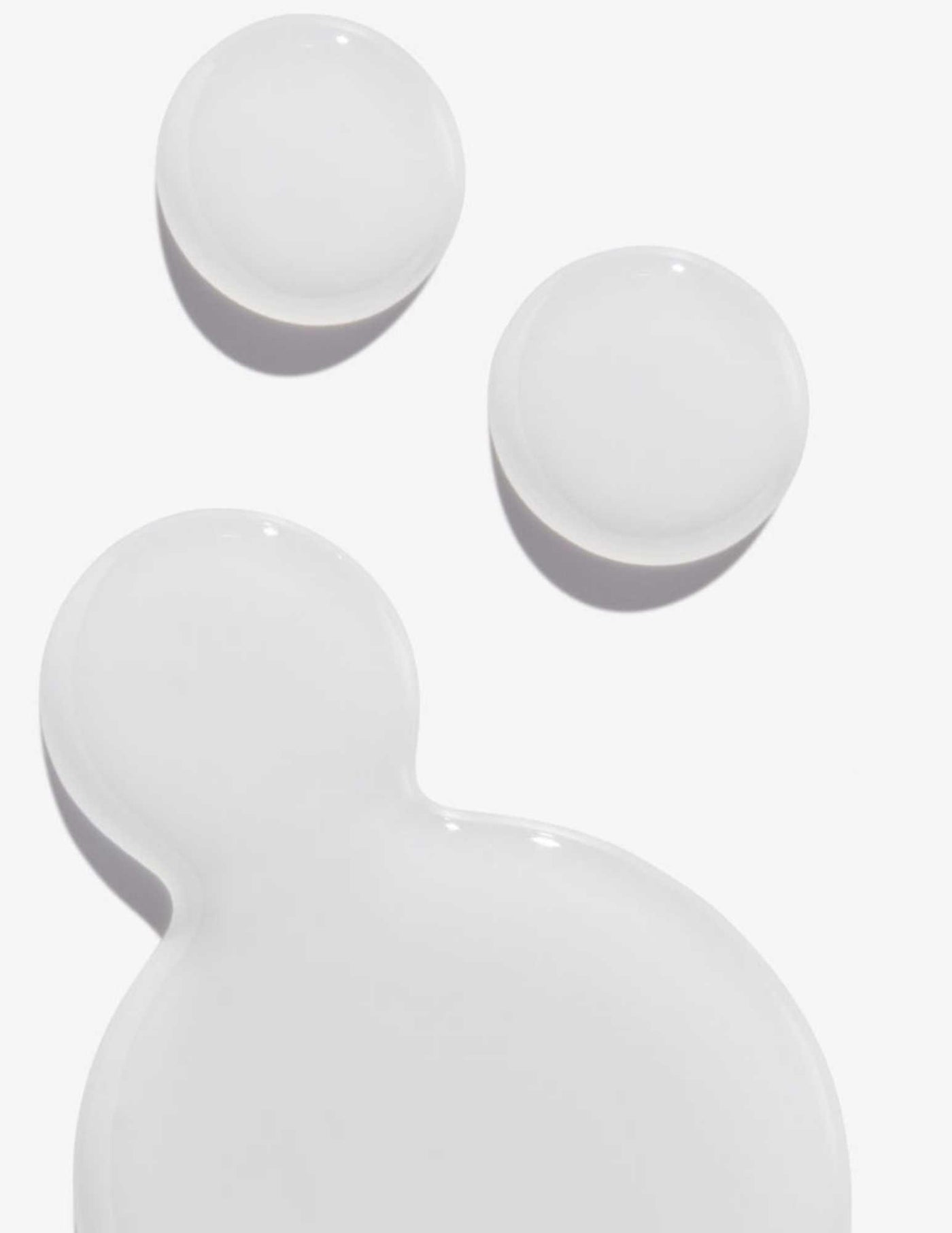 Clear gel texture of a hair treatment, showcasing smoothness and light reflection.