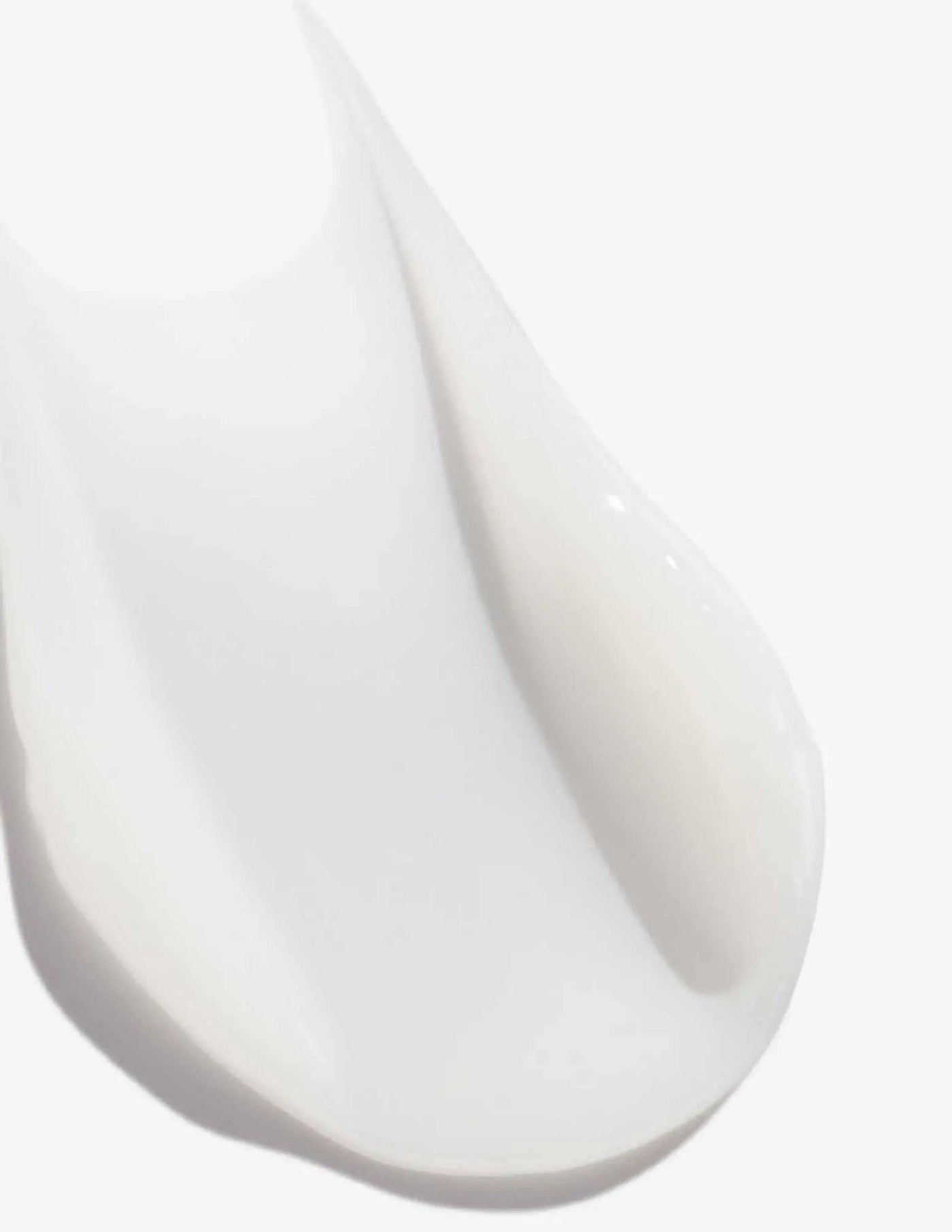Close-up of Redken Acidic Perfecting Concentrate Leave-in Treatment, showcasing its creamy, smooth texture.