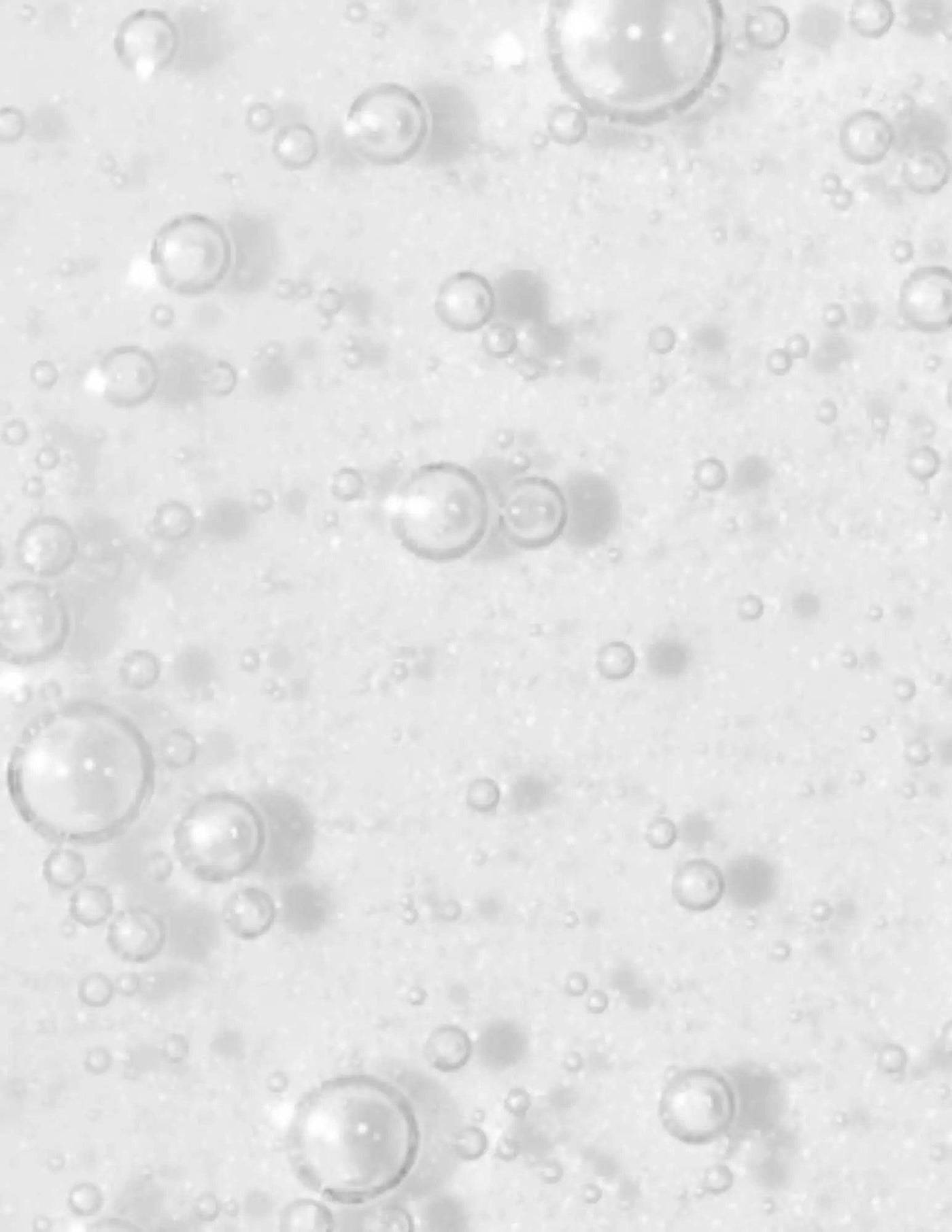 Bubbles on a white background, representing a refreshing and cleansing texture for hair treatments.