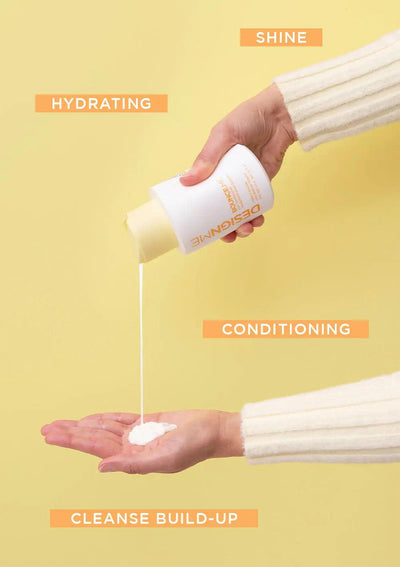 Hand pouring hydrating conditioner from a bottle onto palm, showcasing shine, cleansing build-up, and conditioning benefits.