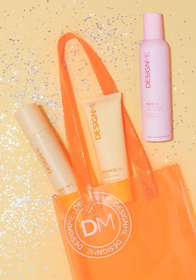 BOUNCE.ME Curl Glow & Go Kit products displayed in an orange tote bag on a glittery background.
