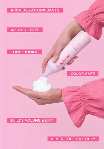 Woman applying Designe Foam on hand, highlighting benefits: alcohol-free, conditioning, color-safe, and build volume.