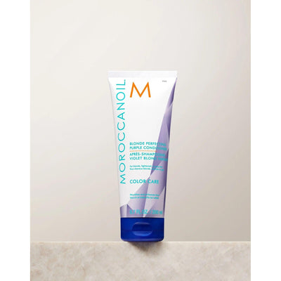 Moroccanoil Blonde Perfecting Purple Conditioner in a tube for color care and enhancing blonde hair.