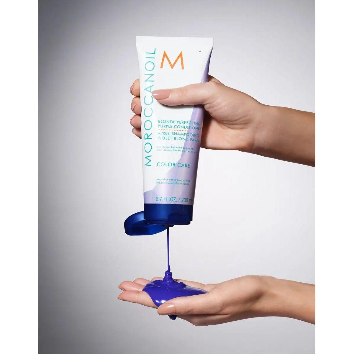 Moroccanoil Color Continue Shampoo being poured into a hand, showcasing its rich, vibrant formula for color care.