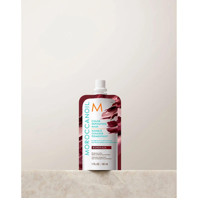 Moroccanoil Color Depositing Mask 30ml in Bordeaux packaging, ideal for rejuvenating and conditioning colored hair.