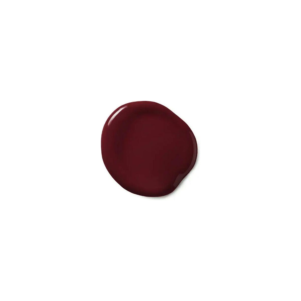 Moroccanoil Color Depositing Mask swatch in deep burgundy hue, showcasing rich color and glossy texture.