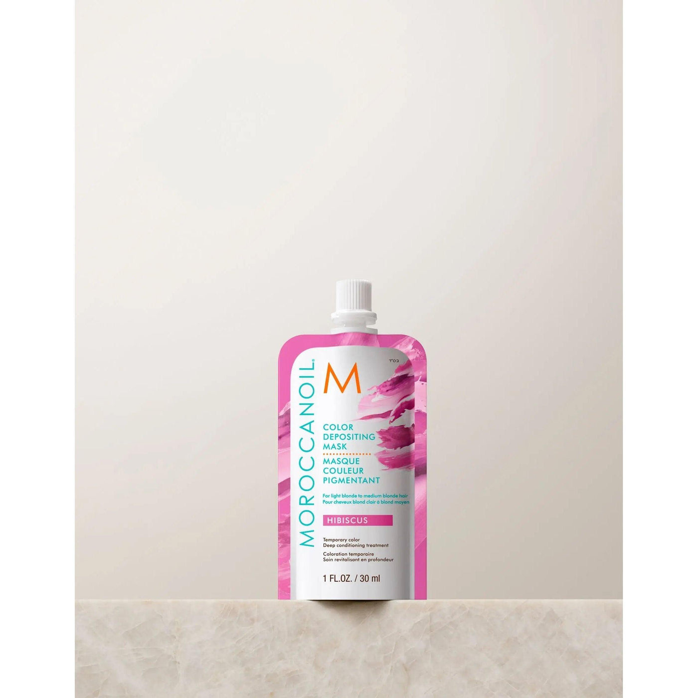 Moroccanoil Color Depositing Mask 30ml in hibiscus, perfect for rejuvenating hair color and adding shine.