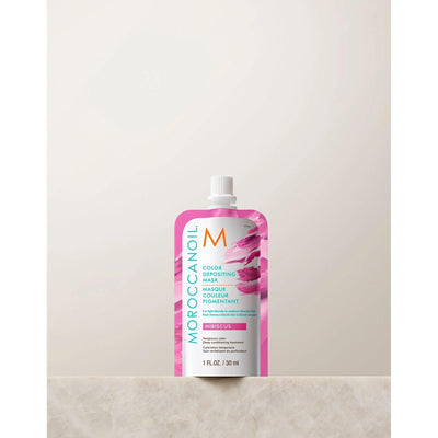 Moroccanoil Color Depositing Mask 30ml in hibiscus, perfect for rejuvenating hair color and adding shine.