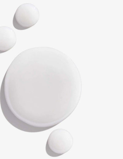 White cream or lotion in various circular shapes on a light background. Perfect for skincare and beauty product visuals.