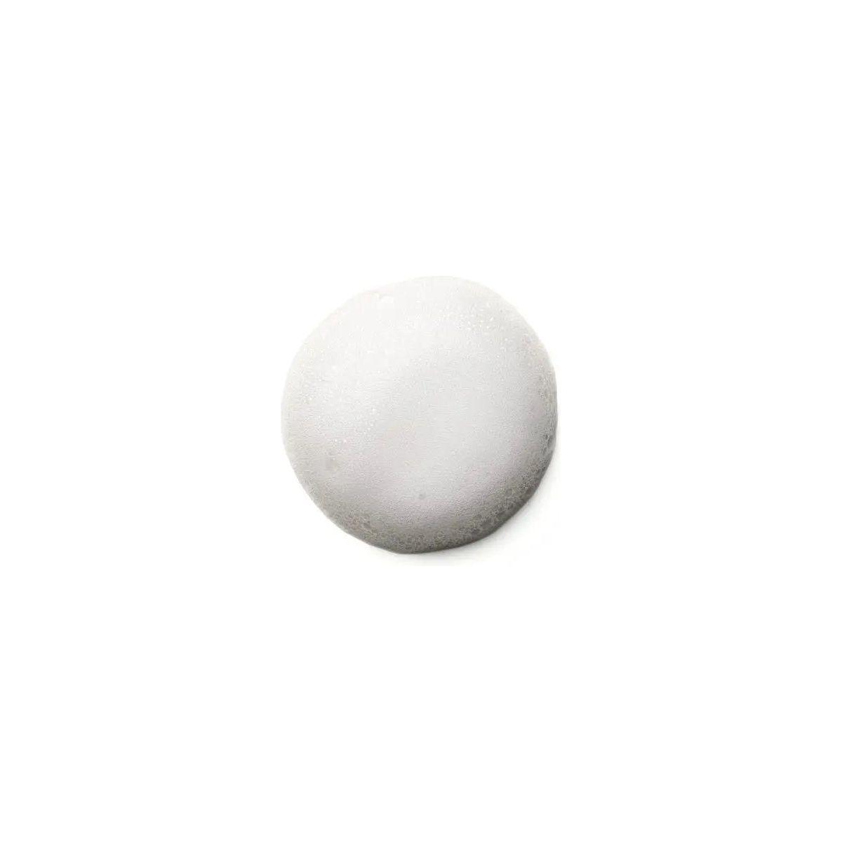 White, fluffy Curl Control Mousse on a clean surface, ideal for defining and controlling curly hair without crunch.
