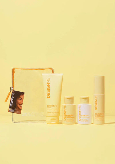 Curl Discovery Kit featuring BOUNCE.ME shampoo, conditioner, curl balm, and spray gel on a yellow background.