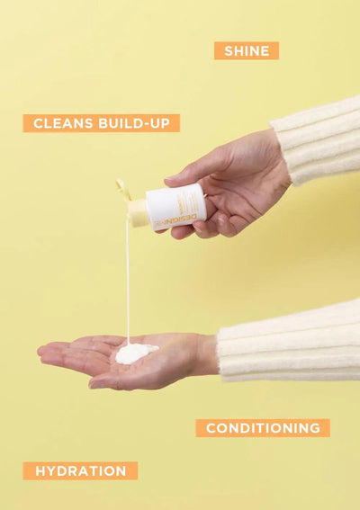 Hand pouring curl product into palm, showcasing shine, hydration, and conditioning benefits on yellow background.