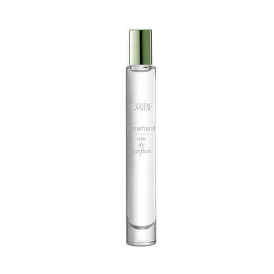 Desertland Eau De Parfum travel spray, featuring notes of juniper berry, lavender, and Texas cedarwood in elegant packaging.