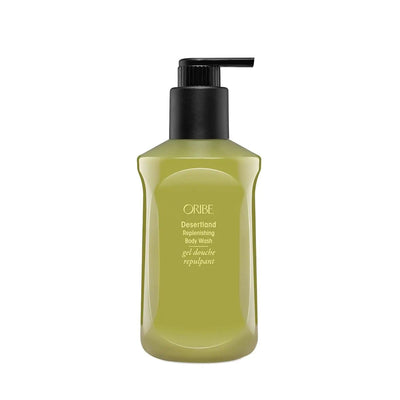 Oribe Desertland Replenishing Body Wash in a sleek green bottle, designed for gentle cleansing and hydrating skincare.
