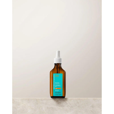 Moroccanoil Dry-No-More Scalp Treatment in amber bottle, designed to hydrate and revitalize dry scalps with natural ingredients.