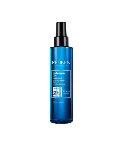 Redken Extreme Cat Treatment spray bottle for strengthening distressed hair, suitable for all hair types and textures.