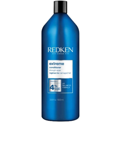 Redken Extreme Conditioner 1L bottle designed for strengthening damaged hair, suitable for all hair types and textures.
