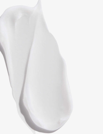 Creamy texture of Redken Extreme Length Conditioner, promoting stronger, healthier hair for all hair types.