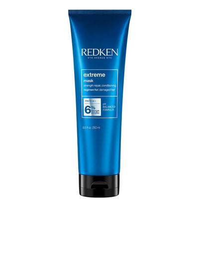 Redken Extreme Mask intensive hair treatment for strengthening and repairing damaged hair in a blue tube.