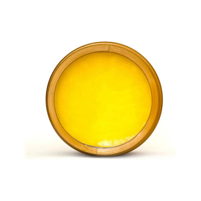 Gold cream in a circular container, perfect for developing a base tan and moisturizing skin.
