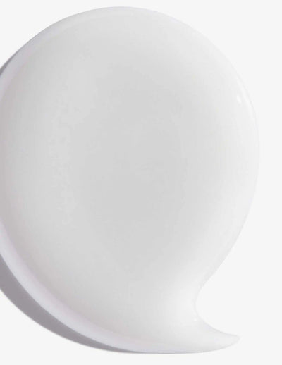 White creamy texture of Redken Hair Cleansing Cream Shampoo for effective hair cleansing and revitalization.