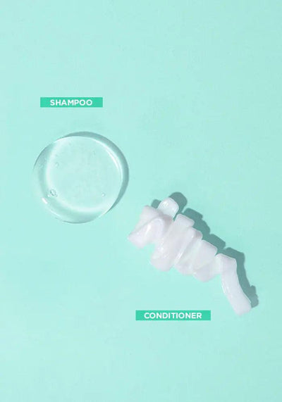 Hydrating shampoo and conditioner display on a mint green background, showcasing their textures for great hair days.