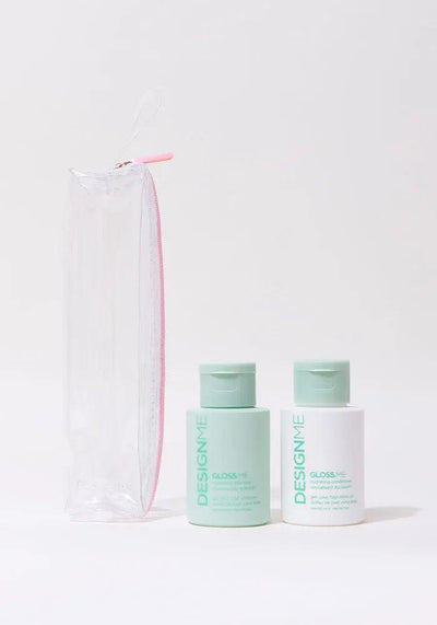 Travel-size GLOSS.ME hydrating shampoo and conditioner in a clear pouch, perfect for festive gifting and hair care routines.