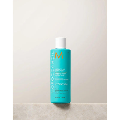 Moroccanoil Hydrating Shampoo bottle on a neutral background for healthy hair hydration and care.
