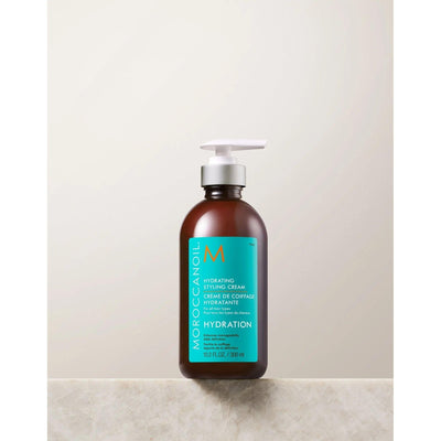 Moroccanoil Hydrating Styling Cream bottle, 10.2 oz, nourishing leave-in cream for soft, frizz-free hair.