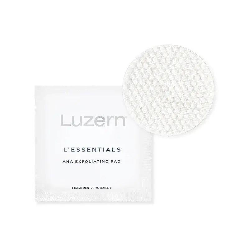 Luzern L'Essentials AHA Exfoliating Pads packaging and pad, designed for gentle skin exfoliation and radiance improvement.