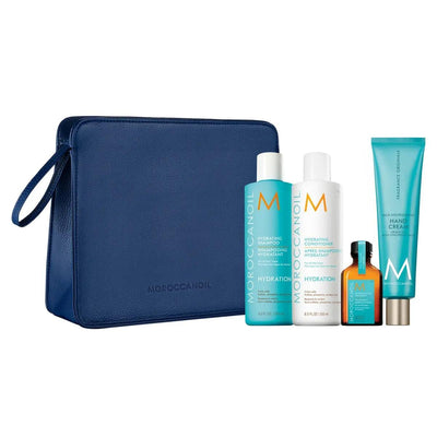 Luminous Wonders Hydration holiday set with shampoo, conditioner, treatment, hand cream, and luxe cosmetic bag.