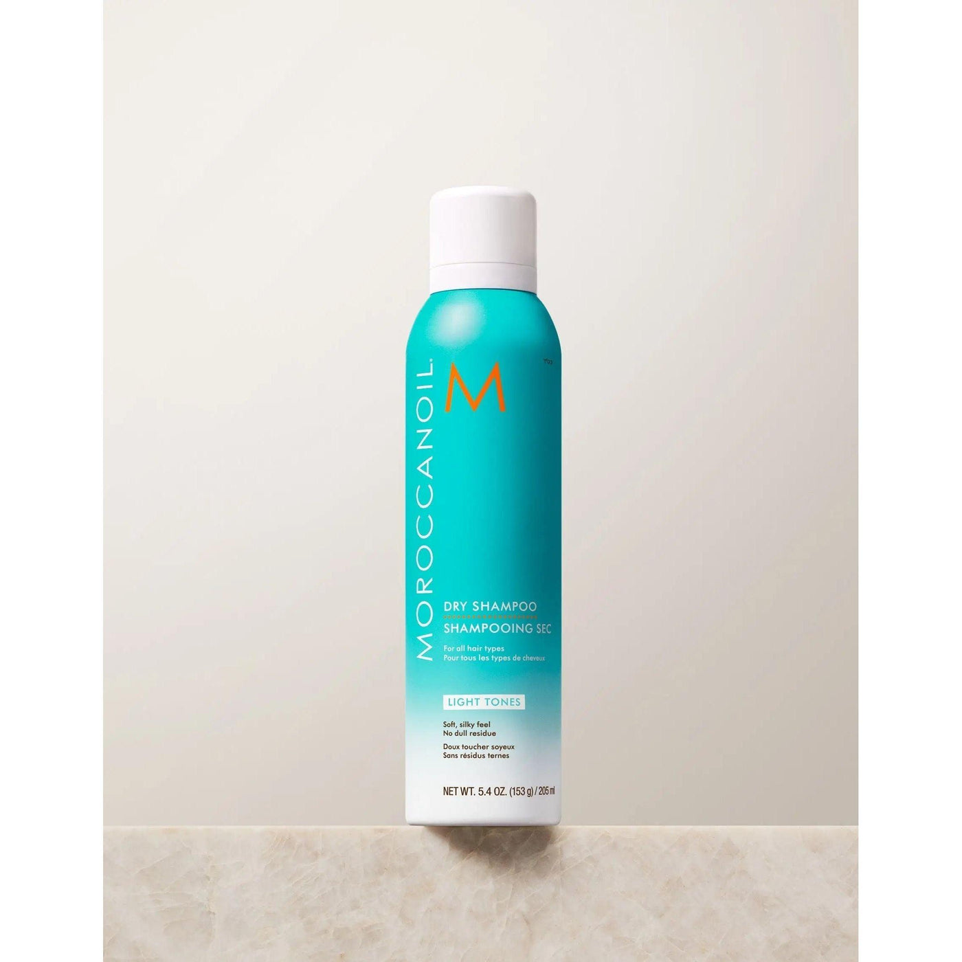 Moroccanoil Dry Shampoo Light Tones, 5.4 oz bottle, oil-absorbing formula for light hair shades, controls brassiness and odor.