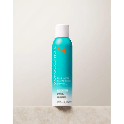 Moroccanoil Dry Shampoo Light Tones, 5.4 oz bottle, oil-absorbing formula for light hair shades, controls brassiness and odor.