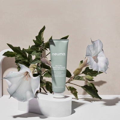 Neuma Neu Curl Perfecting Crème enhances curls with coconut hibiscus aroma, promoting frizz-free, defined waves.