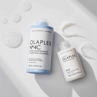 Olaplex No. 4C Bond Maintenance Clarifying Shampoo and No. 3 Hair Perfector bottles with shampoo textures. Ideal for all hair types.