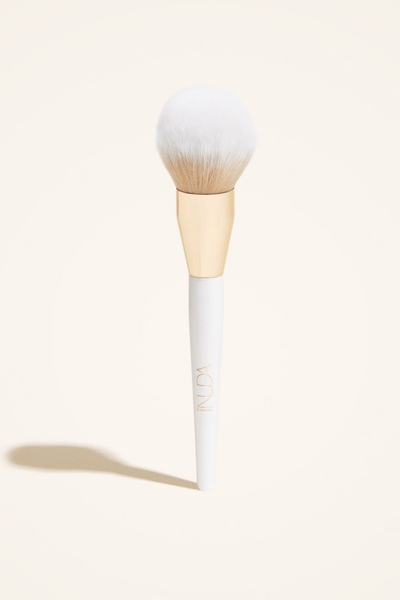 Bronzing powder brush with a dense, soft bristle head for flawless blending and seamless makeup application.