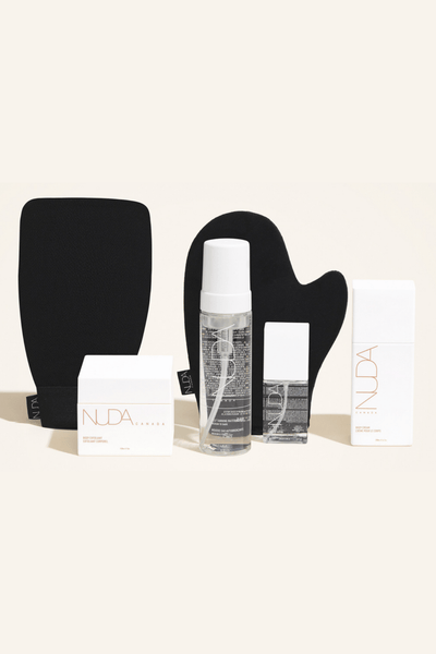 Deluxe Routine Kit featuring Self Tanning Mousse, Exfoliating Mitt, and Body Cream for a customizable tan.